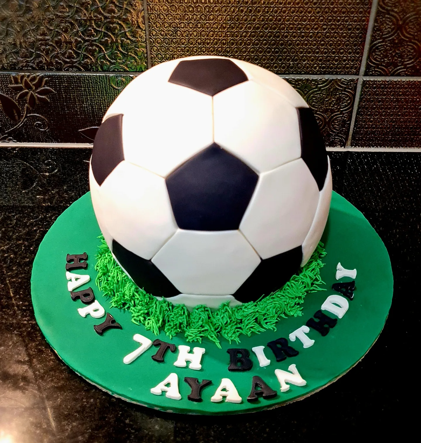 3D soccer ball cake for Ayaan's 7th birthday sports celebration