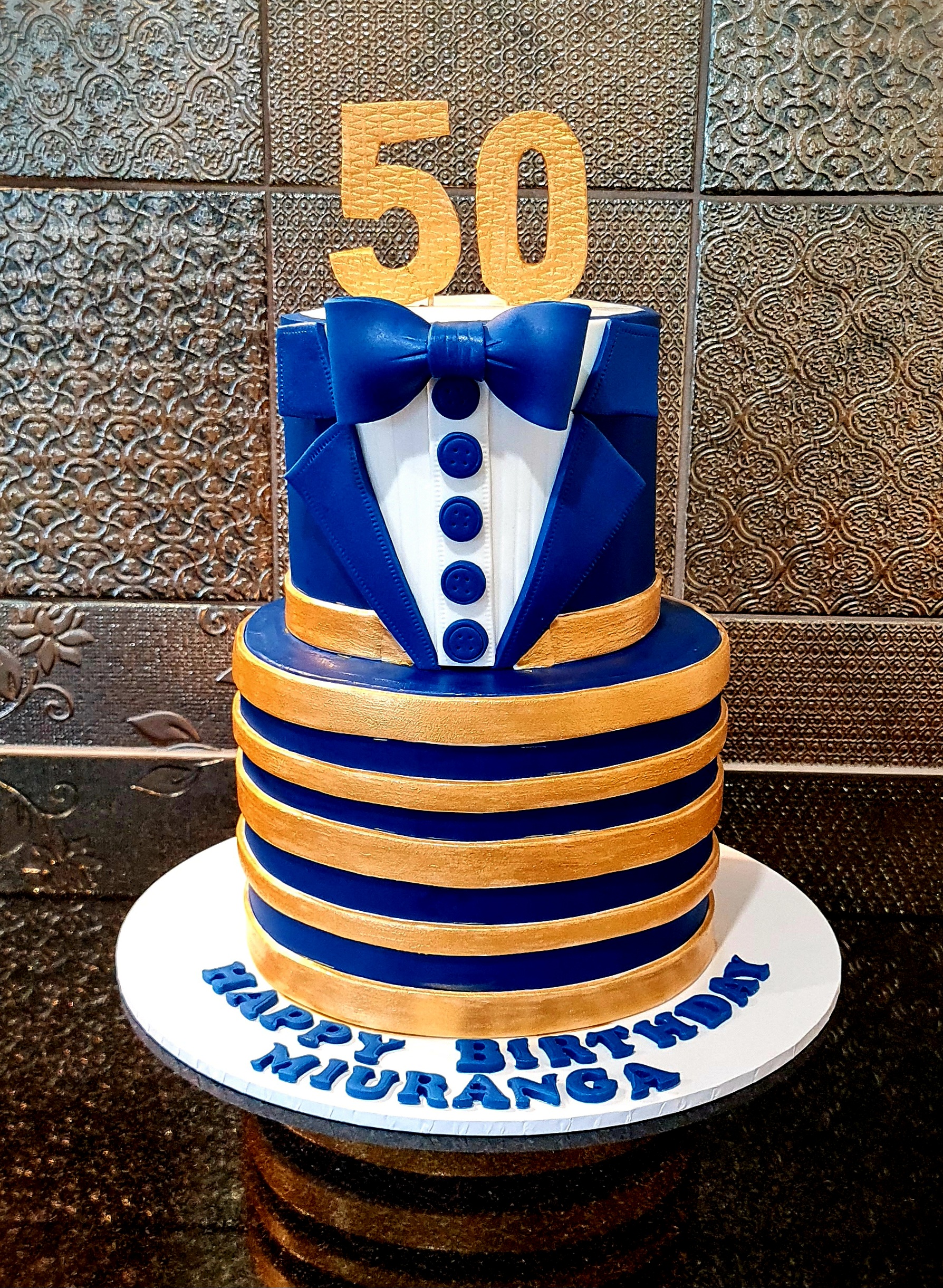 Blue and Gold Tuxedo 50th Birthday Cake for Miuranga's milestone celebration