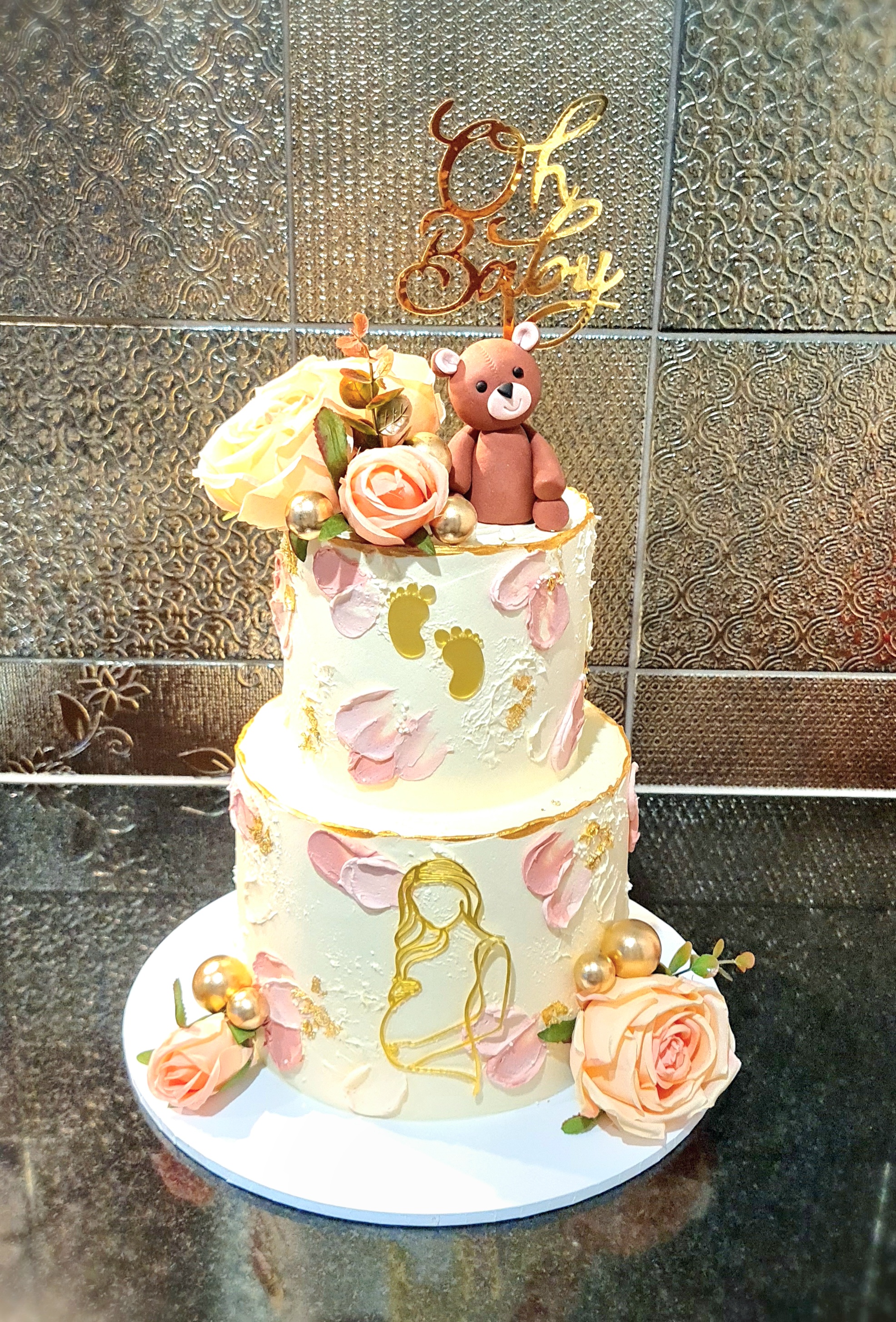 Elegant Baby Shower Cake with Teddy Bear and Florals for welcoming celebration