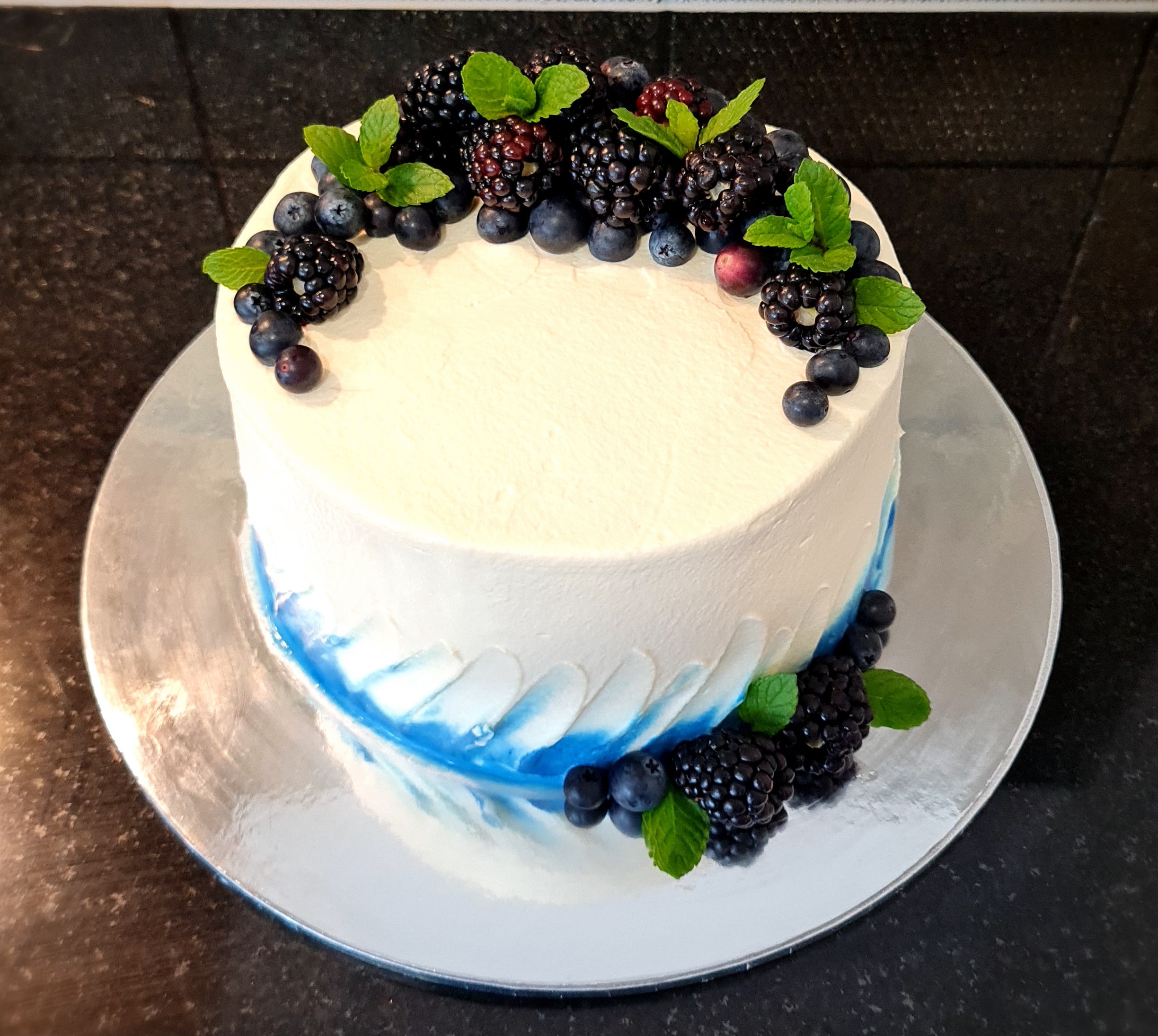 Blackberries Fresh Cream Cake with mixed berries, mint leaves and blue watercolor design