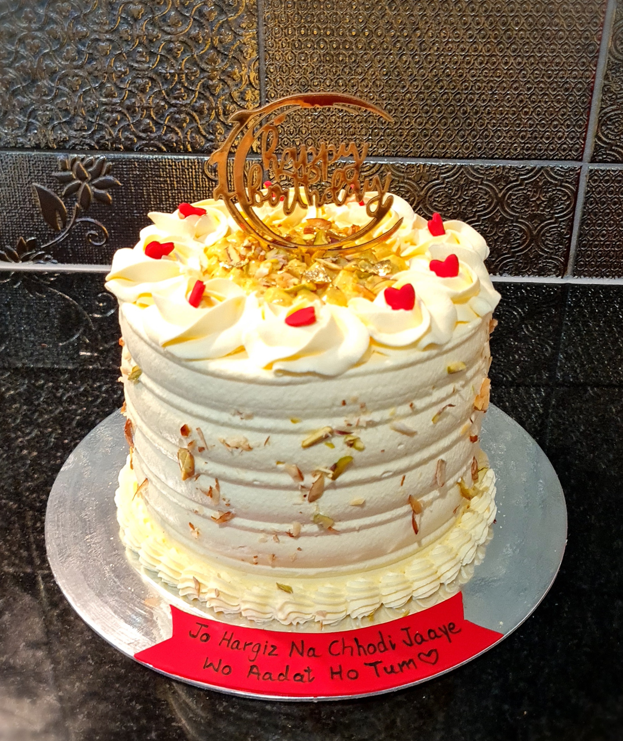 Rabri Kesar Pista Fusion Cake with traditional Indian flavors, nuts, cream rosettes and Hindi message