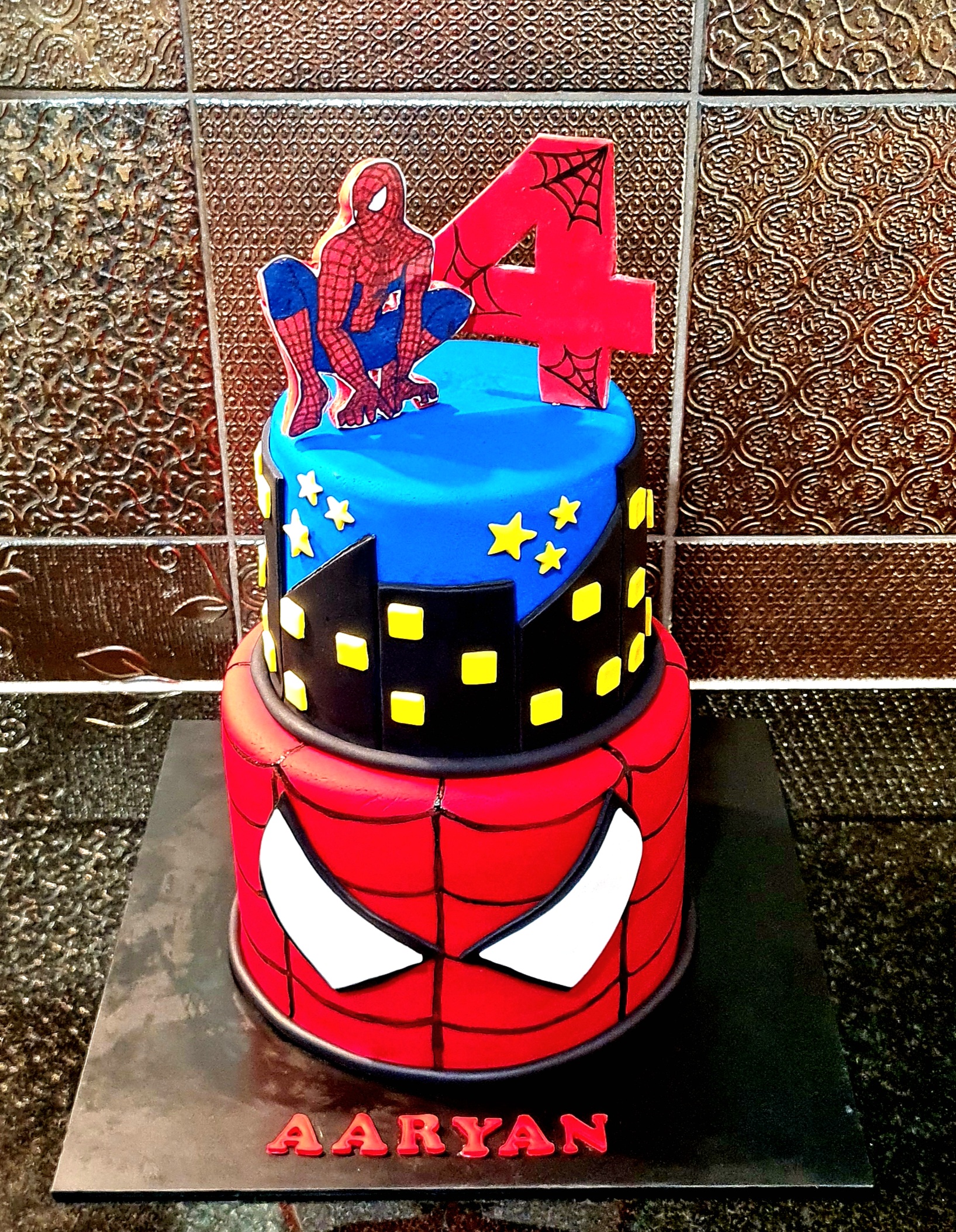 Spiderman cityscape two-tier 4th birthday cake for Aaryan